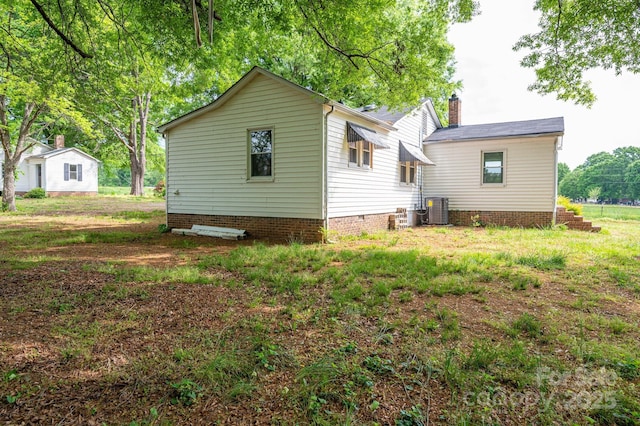 201 Lee Black Rd, Cherryville, NC 28021 - rear view of house featuring central air condition unit and a chimney