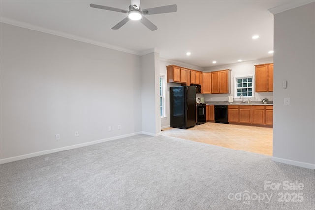 kitchen with crown molding, black appliances, light carpet, baseboards, and recessed lighting