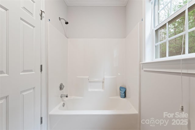 full bath featuring ornamental molding and bathing tub / shower combination