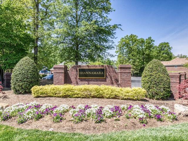 community sign featuring fence