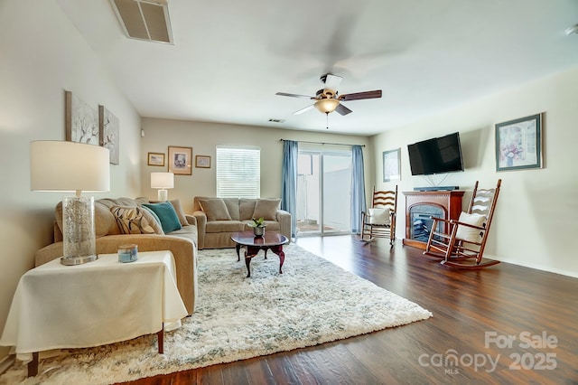 309 River Clay Rd, Fort Mill, SC 29708 - living room with a ceiling fan, dark wood finished floors, a fireplace, and visible vents