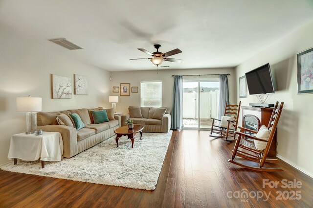 309 River Clay Rd, Fort Mill, SC 29708 - living room with baseboards, dark wood-style flooring, visible vents, and a ceiling fan