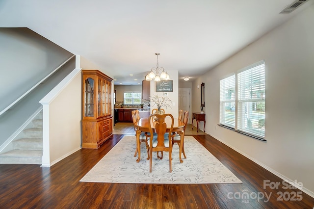 309 River Clay Rd, Fort Mill, SC 29708 - dining space featuring dark wood-style flooring, visible vents, stairs, a wealth of natural light, and a notable chandelier