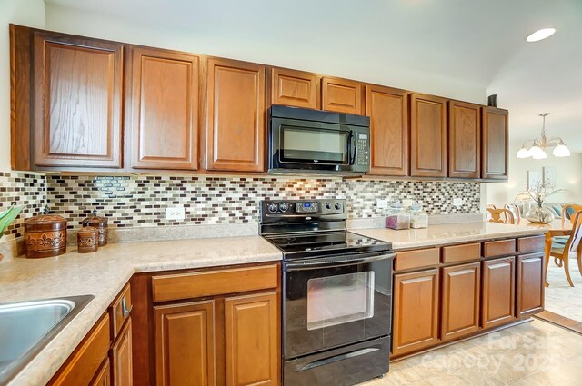 309 River Clay Rd, Fort Mill, SC 29708 - kitchen with light countertops, tasteful backsplash, a sink, black appliances, and brown cabinets
