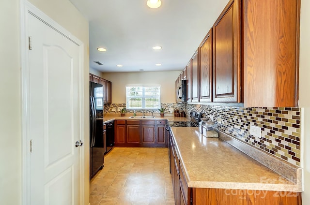 309 River Clay Rd, Fort Mill, SC 29708 - kitchen featuring black appliances, light countertops, a sink, and tasteful backsplash