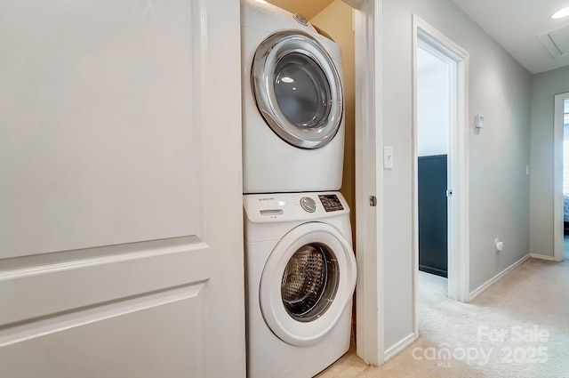 309 River Clay Rd, Fort Mill, SC 29708 - clothes washing area featuring baseboards, stacked washer / dryer, laundry area, and light carpet
