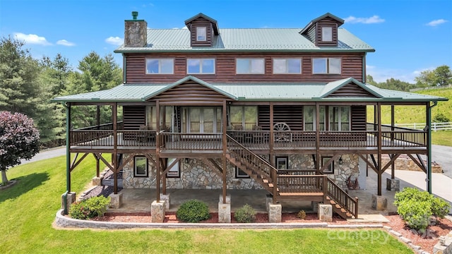 199 Joriann Dr, Crumpler, NC 28617 - back of house featuring a patio area, stairs, a wooden deck, stone siding, and metal roof