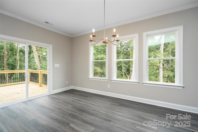 unfurnished dining area featuring a chandelier, dark wood-type flooring, visible vents, baseboards, and ornamental molding