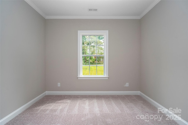 empty room featuring ornamental molding, visible vents, light carpet, and baseboards