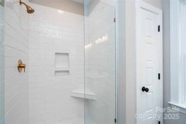 full bath with a shower stall