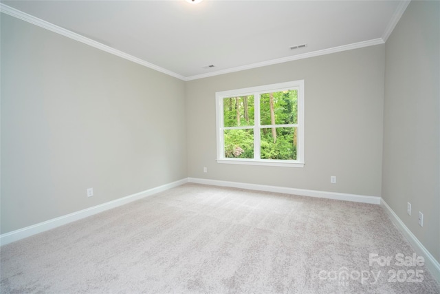 unfurnished room featuring crown molding, visible vents, light colored carpet, and baseboards