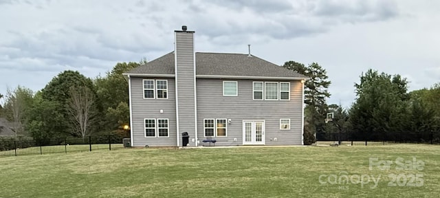 back of property featuring a lawn, roof with shingles, fence, french doors, and a chimney