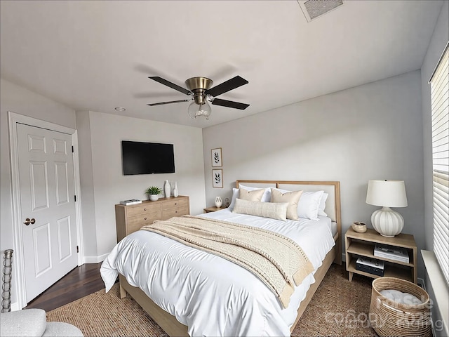 bedroom featuring visible vents, ceiling fan, and wood finished floors