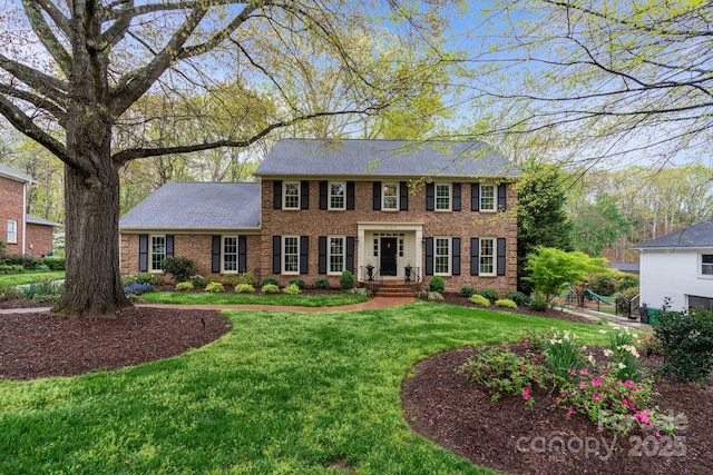 5125 Winding Brook Rd, Charlotte, NC 28226 - view of front of house featuring a front lawn, brick siding, and roof with shingles