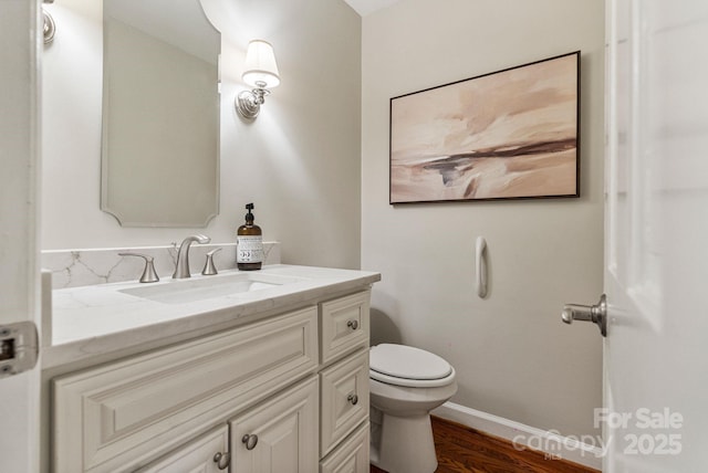 5125 Winding Brook Rd, Charlotte, NC 28226 - bathroom featuring baseboards, wood finished floors, toilet, and vanity