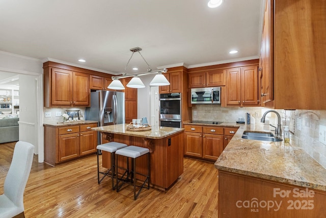 5125 Winding Brook Rd, Charlotte, NC 28226 - kitchen with a sink, light stone counters, brown cabinetry, and appliances with stainless steel finishes