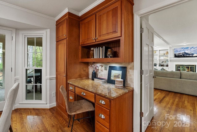 5125 Winding Brook Rd, Charlotte, NC 28226 - office space featuring built in study area, built in shelves, wood finished floors, and crown molding