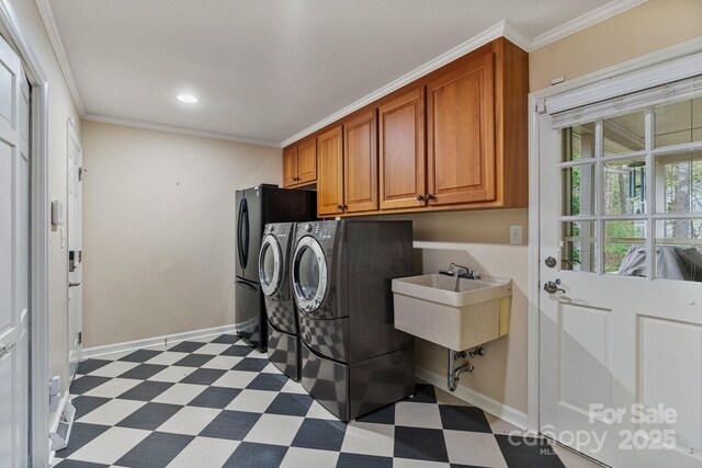 5125 Winding Brook Rd, Charlotte, NC 28226 - laundry area featuring dark floors, washing machine and clothes dryer, cabinet space, and ornamental molding
