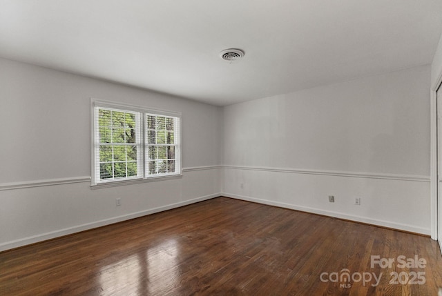 5125 Winding Brook Rd, Charlotte, NC 28226 - spare room featuring dark wood-style flooring, baseboards, and visible vents
