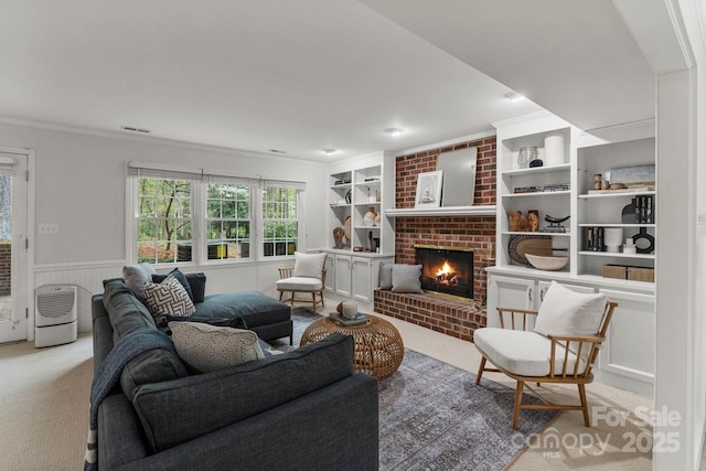 5125 Winding Brook Rd, Charlotte, NC 28226 - living room featuring crown molding, carpet floors, a brick fireplace, wainscoting, and visible vents