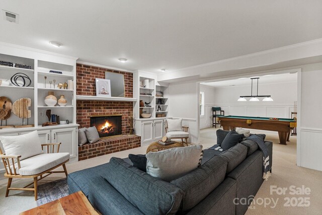 5125 Winding Brook Rd, Charlotte, NC 28226 - living area featuring a wainscoted wall, a brick fireplace, billiards, visible vents, and ornamental molding