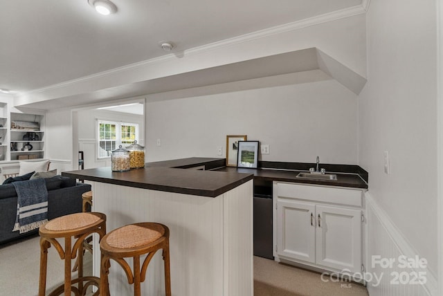 5125 Winding Brook Rd, Charlotte, NC 28226 - kitchen featuring a sink, dark countertops, a kitchen breakfast bar, and open floor plan