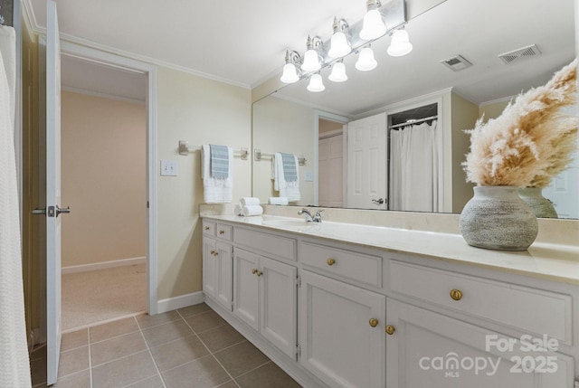 5125 Winding Brook Rd, Charlotte, NC 28226 - bathroom with vanity, crown molding, baseboards, tile patterned floors, and visible vents