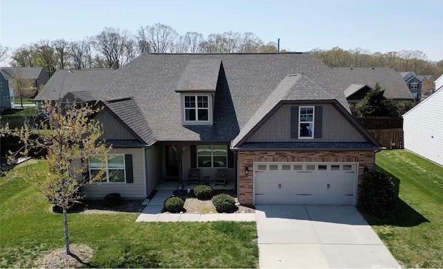 4425 Marlay Park, Indian Trail, NC 28079 - craftsman-style house featuring driveway, roof with shingles, an attached garage, and stone siding