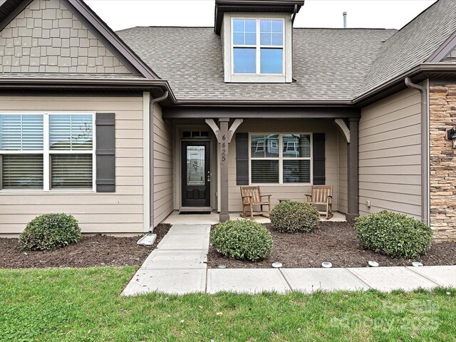 4425 Marlay Park, Indian Trail, NC 28079 - doorway to property with roof with shingles and a porch