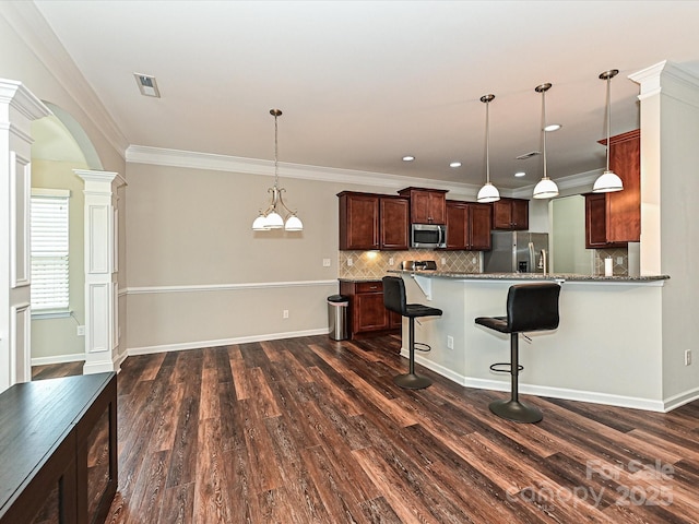 4425 Marlay Park, Indian Trail, NC 28079 - kitchen with appliances with stainless steel finishes, decorative columns, dark wood-style floors, tasteful backsplash, and crown molding