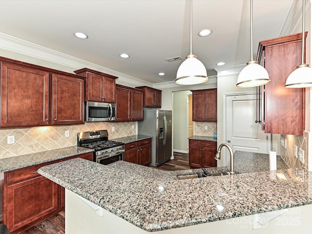 4425 Marlay Park, Indian Trail, NC 28079 - kitchen with stainless steel appliances, a sink, crown molding, dark wood finished floors, and stone countertops