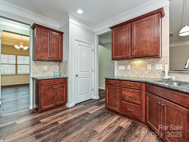 4425 Marlay Park, Indian Trail, NC 28079 - kitchen with a sink, dark wood-style floors, a chandelier, dark stone counters, and backsplash