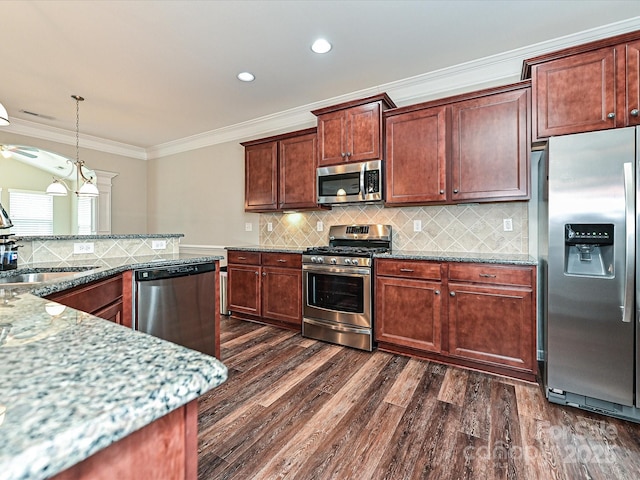 4425 Marlay Park, Indian Trail, NC 28079 - kitchen with appliances with stainless steel finishes, a sink, dark wood finished floors, crown molding, and light stone counters