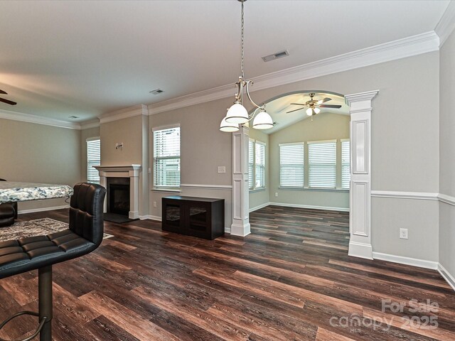4425 Marlay Park, Indian Trail, NC 28079 - unfurnished living room featuring a ceiling fan, dark wood-style flooring, a fireplace, ornamental molding, and baseboards
