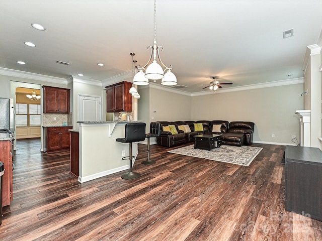 4425 Marlay Park, Indian Trail, NC 28079 - living area featuring a ceiling fan, dark wood-style flooring, recessed lighting, ornamental molding, and baseboards