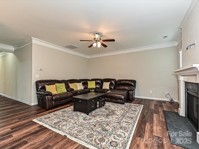 4425 Marlay Park, Indian Trail, NC 28079 - living room featuring dark wood-style floors, ceiling fan, a fireplace, crown molding, and baseboards