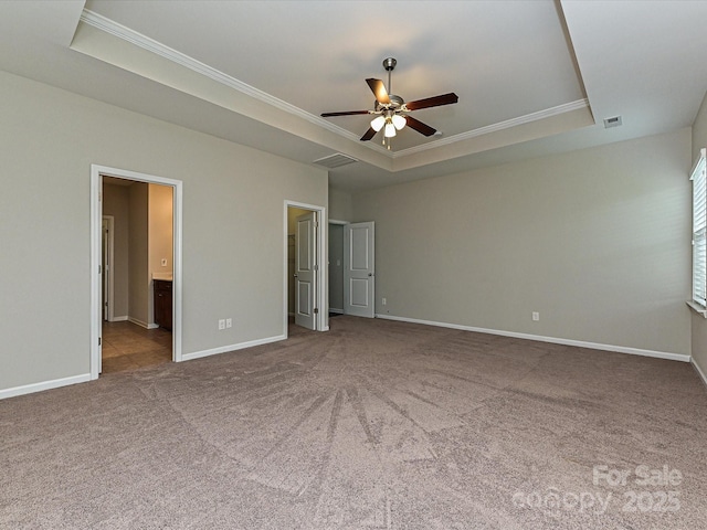 4425 Marlay Park, Indian Trail, NC 28079 - unfurnished bedroom featuring a tray ceiling, crown molding, carpet floors, baseboards, and ensuite bath