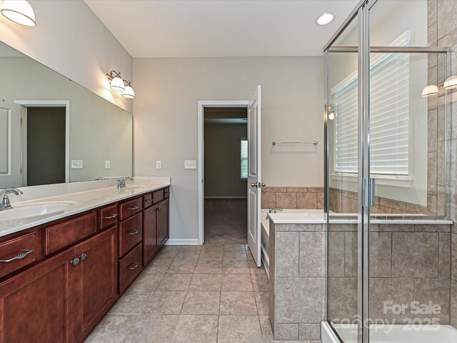4425 Marlay Park, Indian Trail, NC 28079 - full bath featuring double vanity, a bath, a shower stall, tile patterned flooring, and baseboards