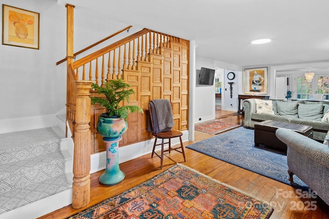 144 Miller Dr, Tryon, NC 28782 - living area featuring stairway, hardwood / wood-style flooring, and baseboards