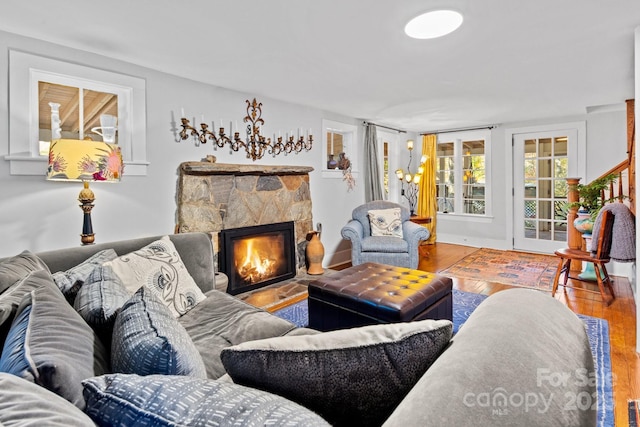 144 Miller Dr, Tryon, NC 28782 - living area featuring a stone fireplace and wood finished floors