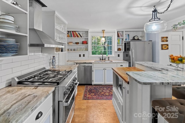 144 Miller Dr, Tryon, NC 28782 - kitchen featuring wall chimney range hood, open shelves, and appliances with stainless steel finishes