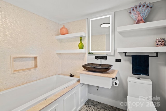 144 Miller Dr, Tryon, NC 28782 - full bath with toilet, a sink, a tub to relax in, and baseboards