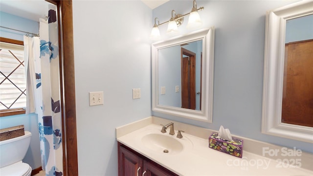 full bath featuring toilet and vanity
