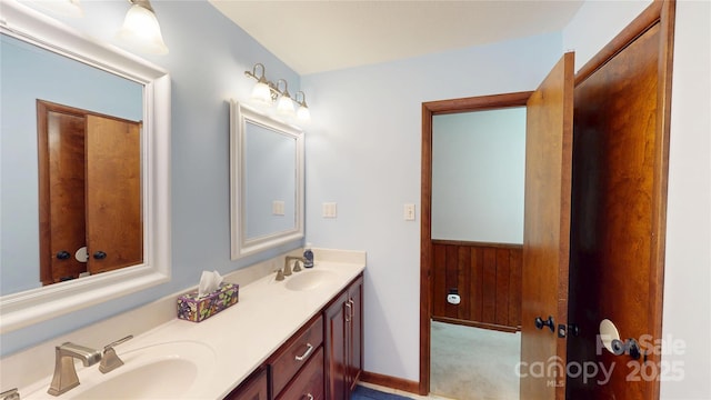 full bath featuring a sink and double vanity