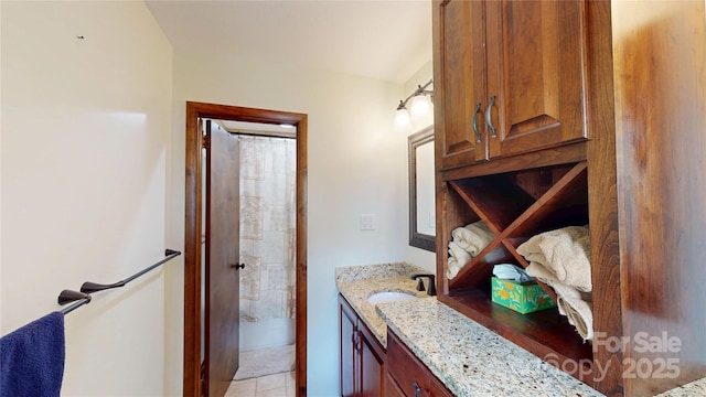 bathroom featuring curtained shower and vanity