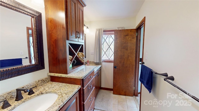 bathroom featuring baseboards and vanity