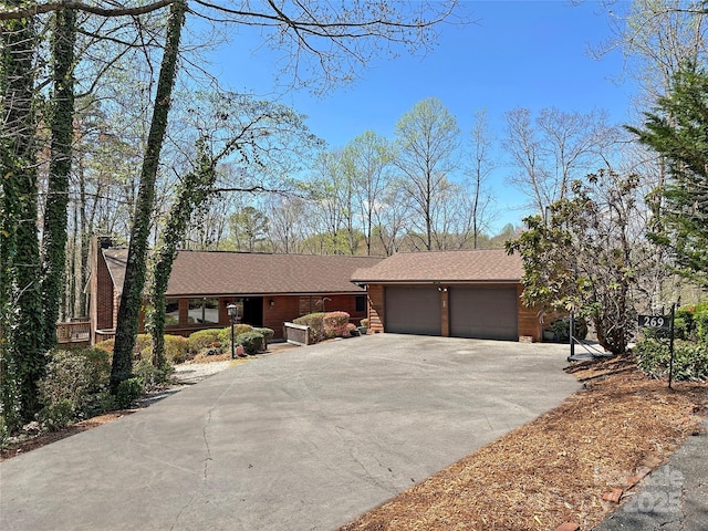 view of front of house with an attached garage and driveway