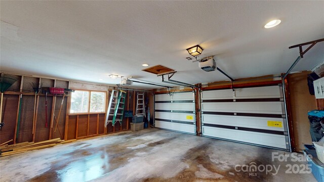 garage featuring a garage door opener