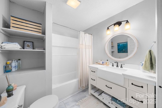 bathroom featuring toilet, a textured ceiling, vanity, and shower / bath combination with curtain