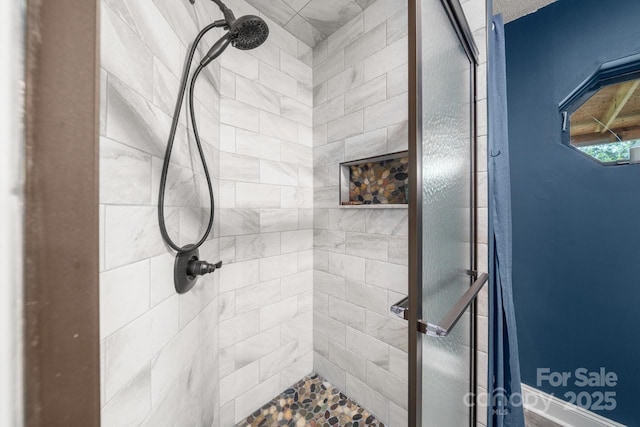 full bathroom featuring a shower stall